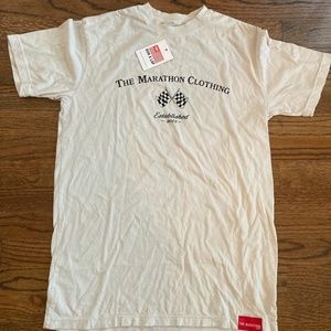 Beige The Marathon Continues T-Shirt. Size Medium